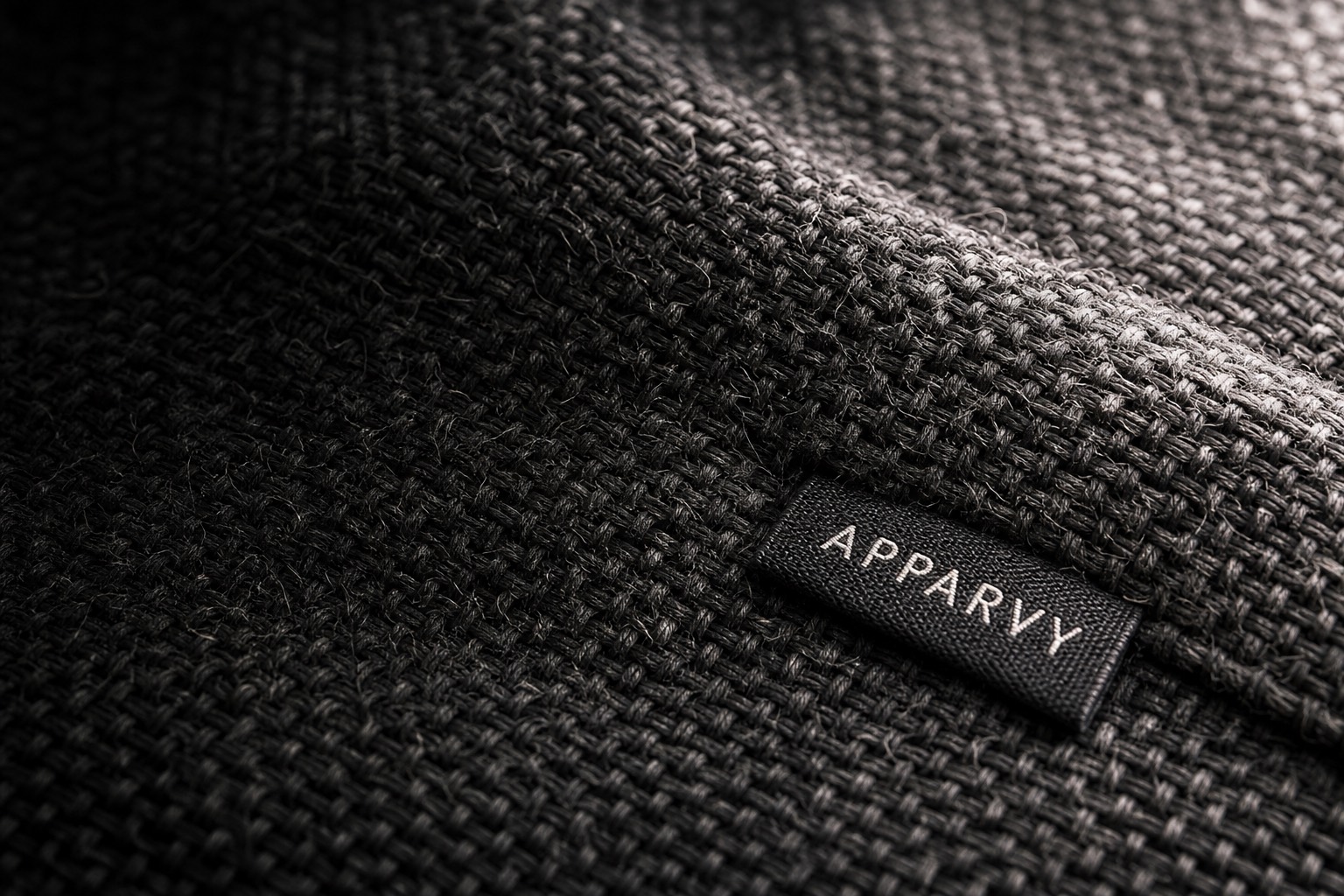 Macro view of Apparvy heavyweight cotton weave with woven brand label